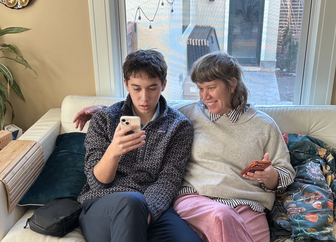Mom and her son side by side on the couch