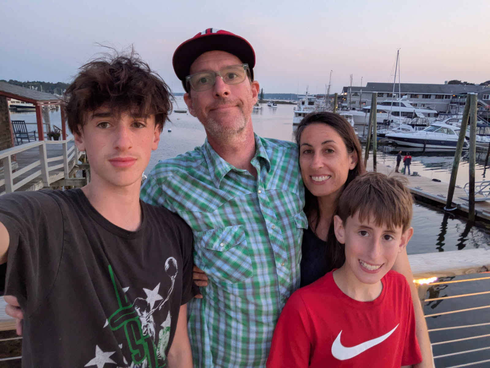The Herman family together at the marina at sunset