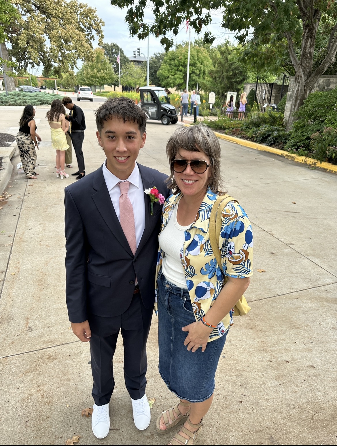Mom with her son in a suit before the dance