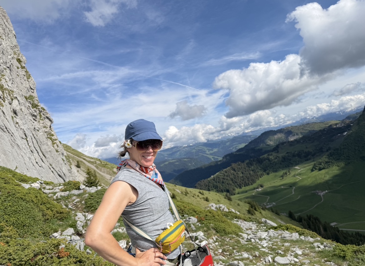 Mom hiking on a mountainside in Switzerland